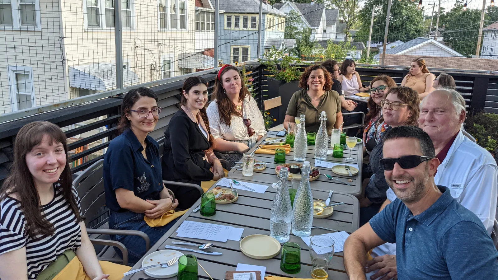 Group of people around some tables