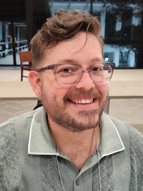 Photo of Jesse Fivecoate smiling. 